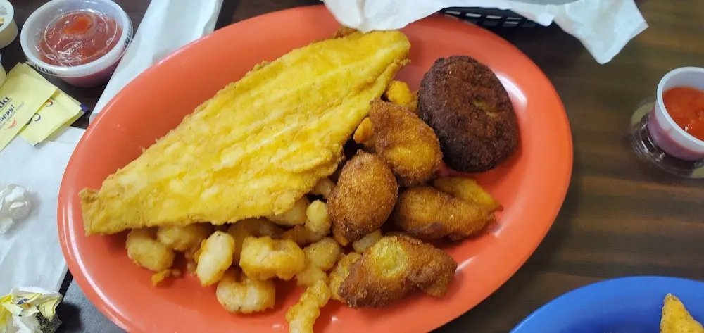 Fried Seafood Combo- Fried Clam Strips Flounder Scallops Crab Cake and Hushpuppies Okra